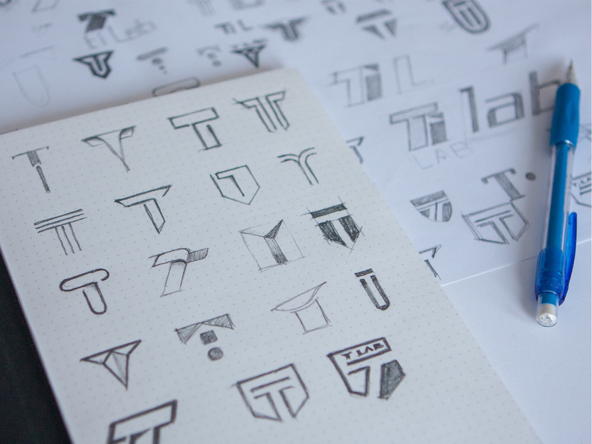 Pencil sketches of the T-Lab T monogram